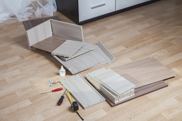 depositphotos_113338550-stock-photo-putting-together-self-assembly-furniture